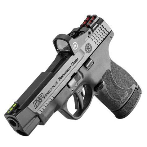Smith & Wesson Shield Plus Performance Center 9mm pistol with ported barrel, fiber optic sights, flat-faced trigger, and 13-round extended magazine – optimized for concealed carry and precision control